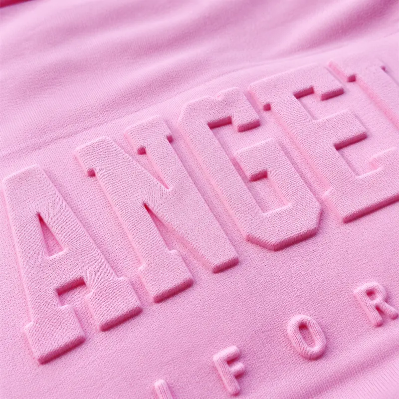 Raised tone-on-tone lettering on pink fabric